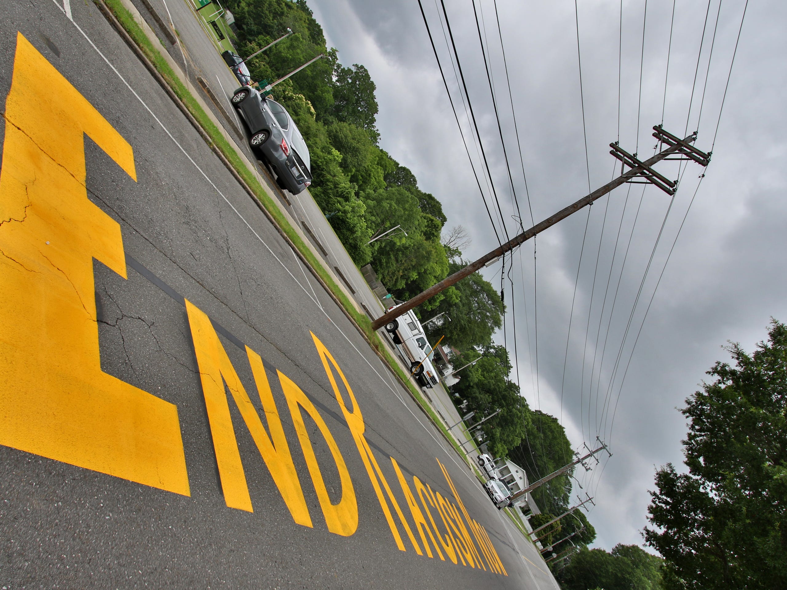 The phrase &ldquo;End Racism Now&rdquo; painted on West Church Street in Dallas Monday morning, June 22, 2020.