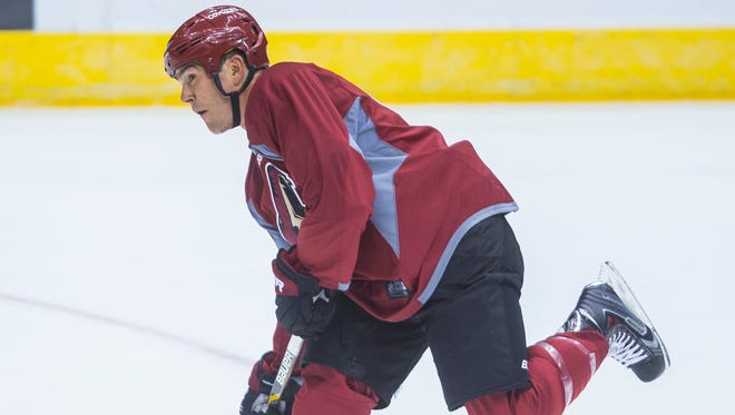 The Coyotes' Steve Downie skates down ice and shoots during a Team C practice at Gila River Arena in Glendale on September 18, 2015.