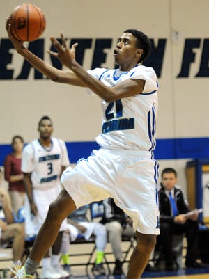 Eastern Florida State's Marcus Barham goes for a layup during a recent game. Barham has been productive in his first eight games with the Titans.