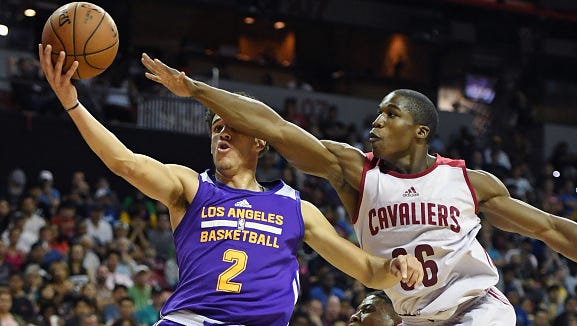 Gates Chili graduate Gerald Beverly, right, tries to block a shot by Lakers rookie Lonzo Ball in Thursday night's 94-83 Los Angeles win in the NBA Summer League in Las Vegas. Beverly played last season for the Cleveland Cavaliers' developmental team, the Canton Charge in Ohio.