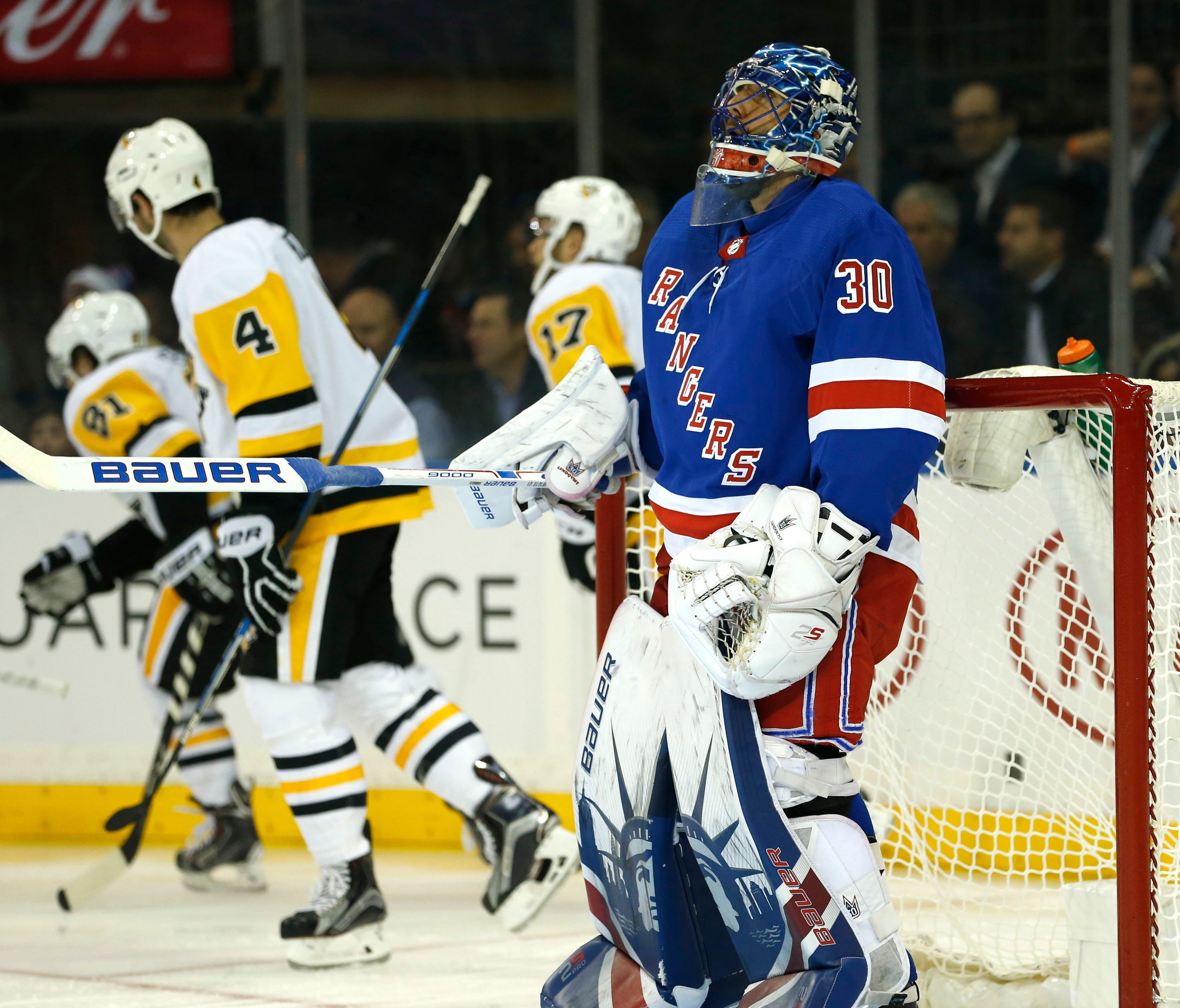 New York Rangers goalie Henrik Lundqvist reacts after giving up a goal to Pittsburgh Penguins right wing Phil Kessel (81) during the first period at Madison Square Garden on Tuesday.