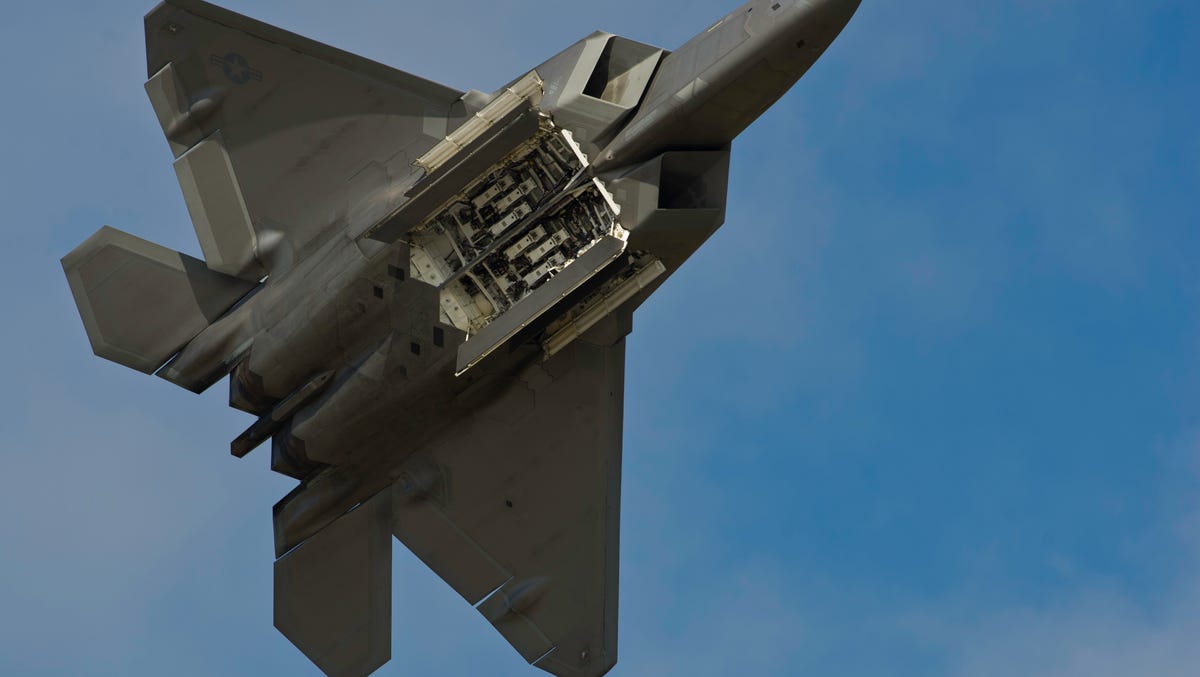 An F-22 Raptor displays its weapons bays in July. The aircraft took part in its first combat operation Monday over Syria.