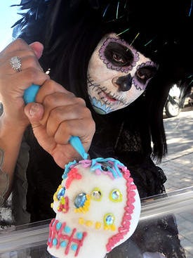 Santa Teresa resident Michelle Padilla applies frosting a sugar skull during a past Dia de las Muertos celebrations in Mesilla. This year, Day of the Dead events and altar building will be Oct. 28-30 on the Mesilla Plaza, followed by a costumed cemetery procession at dusk on Nov. 2.