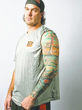 Cincinnati Bengals long snapper Clark Harris (46) shows the tattoo on his left arm, featuring beach scenes, and a lighthouse from his home town of Long Beach Island, New Jersey.