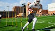 Taeler Dowdy (35) does a drill during spring training