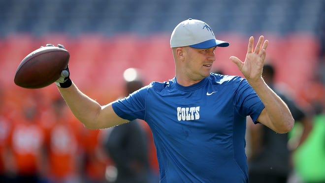 Indianapolis Colts Matt Hasselbeck warms prior to their game. The Indianapolis Colts play the Denver Broncos Sunday, September 7, 2014, evening at Sports Authority Field at Mile High in Denver CO.