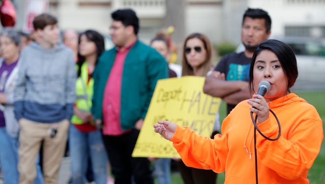 Alma Torres of Green Bay speaks at a rally in support of the Deferred Action for Childhood Arrivals act (DACA) on Monday outside the Brown County Courthouse in Green Bay.