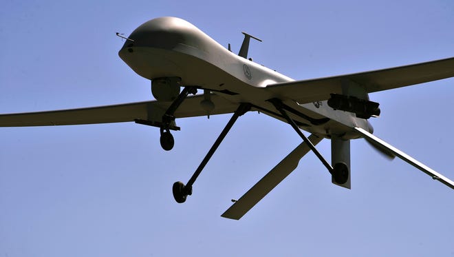 This file photo taken on October 21, 2015 shows a US Air Force MQ-1B Predator remotely piloted aircraft as it flies overhead during a training mission in Nevada.