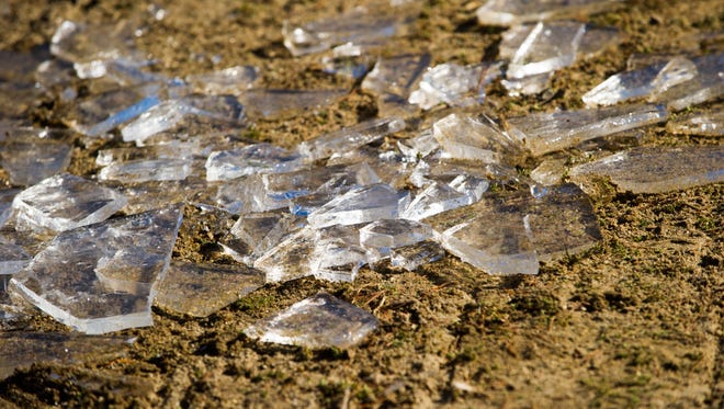 Chunks of ice shimmer like diamonds scattered on the beach before the start of the Polar Plunge fundraiser for Special Olympics Indiana at Scales Lake in Boonville, Saturday, Feb. 4, 2017.
