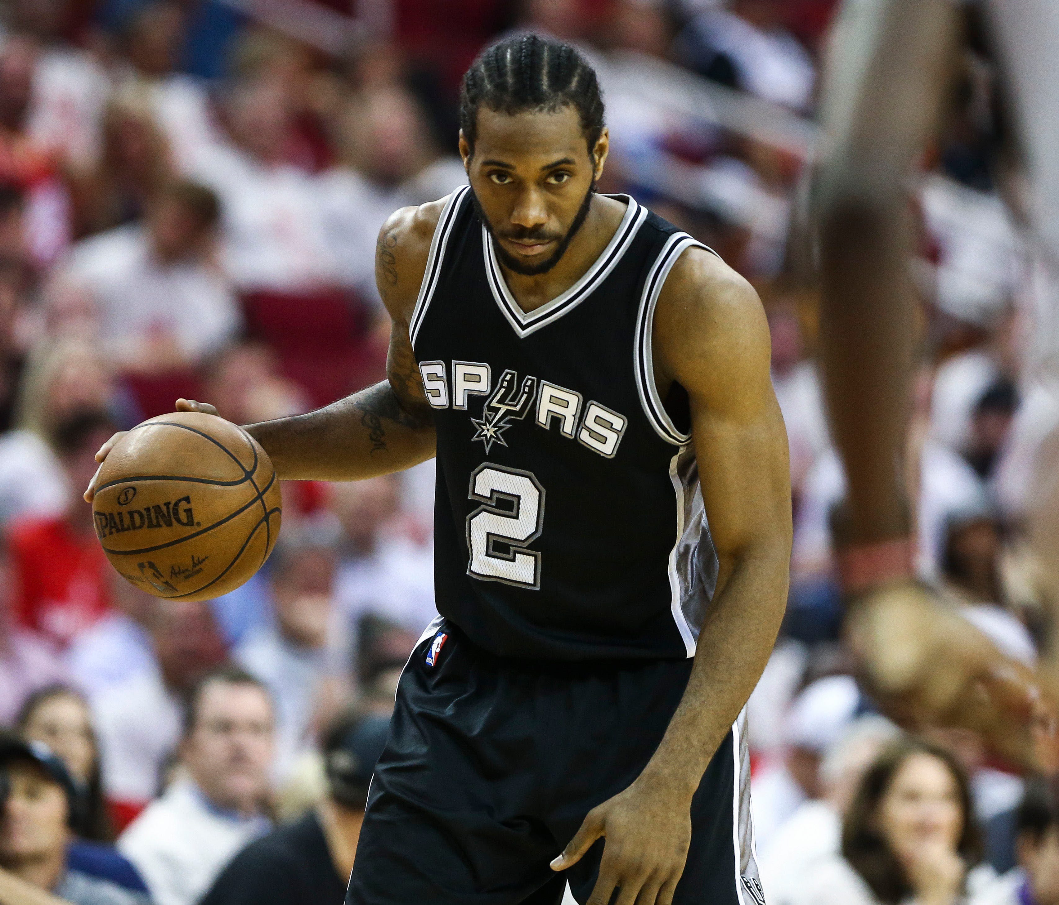San Antonio Spurs forward Kawhi Leonard (2) dribbles the ball during the third quarter against the Houston Rockets in game four of the second round of the 2017 NBA Playoffs at Toyota Center.