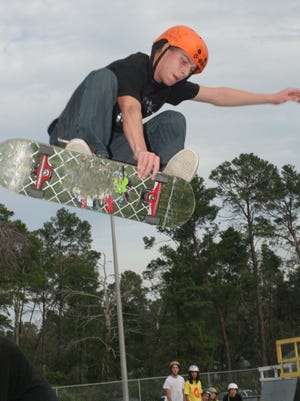 Matt Call flies over a rail during the Goofy vs Regular Foot Contest at Graffiti Skate Zone in this February 2007 photo.