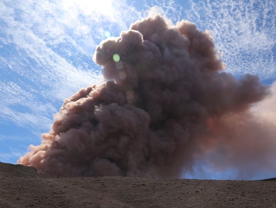 Hawaiian volcano sends lava into