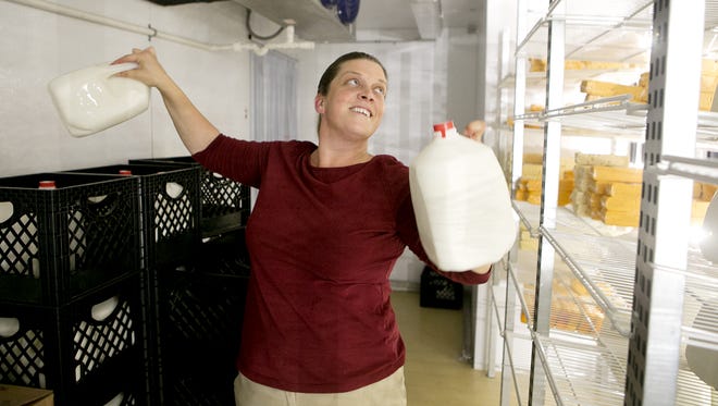 Seehafer Farm Creamery general manager Stephanie Seehafer unloads whole milk at the store north of Marshfield.