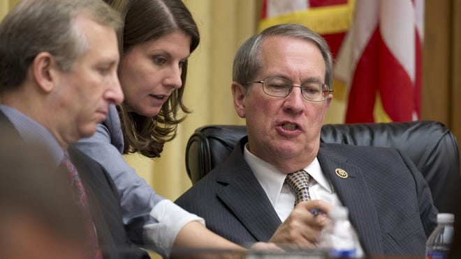 House Judiciary Committee Chairman Rep. Bob Goodlatte, R-Va., right, confers with his aide during his committee's hearing on Capitol Hill in Washington July 14, 2015. In a rare move for the bitterly partisan House, Republicans and Democrats have come together to propose major legislation that would reduce prison sentences for some nonviolent drug offenders. Conservative Republicans and liberal Democrats on the House Judiciary Committee planned to announce the legislation at a news conference Thursday.