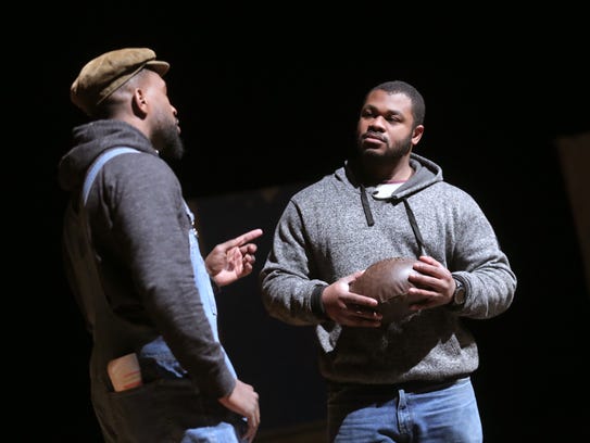 Mike Barbosa, right, portrays Charles Follis and Damian