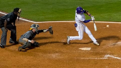 LSU's Kramer Robertson hits a bases-loaded single in the bottom of the ninth inning against Tennessee in a college baseball game in the Southeastern Conference tournament Tuesday, May 24, 2016, in Birmingham, Ala. (Vasha Hunt/AL.com via AP)