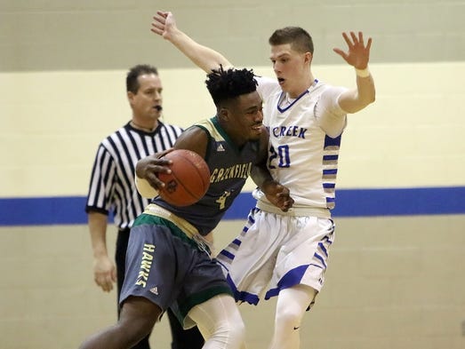 Greenfield's Rayon Bartlett drives into Oak Creek's