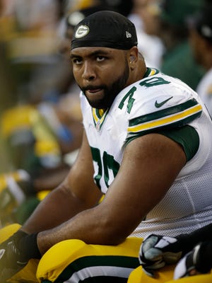 Packers right tackle Derek Sherrod looks toward the scoreboard while sitting on the sidelines in the second half of the team’s Week 1 loss at Seattle.