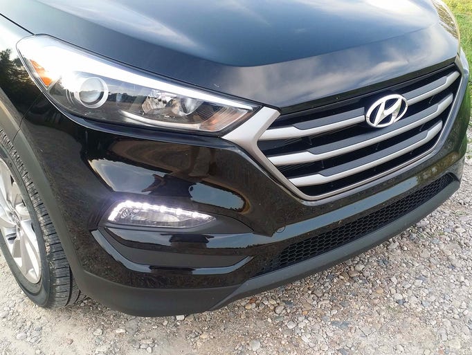 The front is dominated by a hexagonal-shaped grille