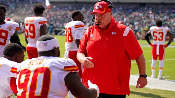 Kansas City Chiefs head coach Andy Reid talks to K