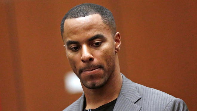 Former NFL player Darren Sharper had 20 Ambien pills in his possession when Los Angeles police arrested him on suspicion of two rapes there in October and January.