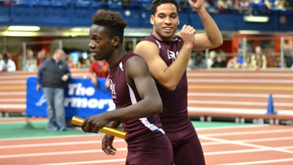 Dwight Morrow's Quanzie Lumsden, left, and Lisandro Ulerio after winning 4-x-400 relay at The Armory.