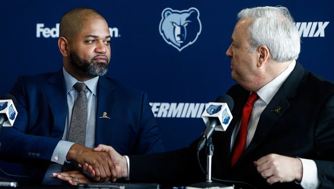 Memphis Grizzlies interim head coach J.B. Bickerstaff (left) is introduced by General Manager Chris Wallace (right) as the team's eighth full-time head coach since the franchise moved to Memphis in 2001.