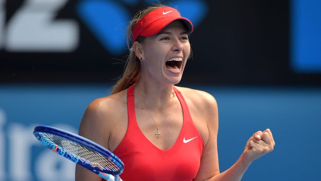 Russia's Maria Sharapova celebrates after victory in her women's singles semi-final match against Russia's Ekaterina Makarova on day eleven of the 2015 Australian Open tennis tournament in Melbourne on January 29, 2015.