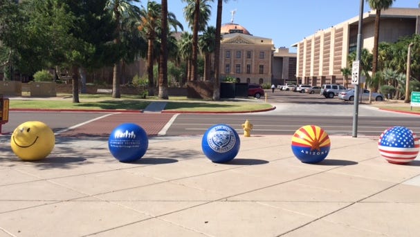 The Arizona Department of Economic Security sports brightly painted security barriers