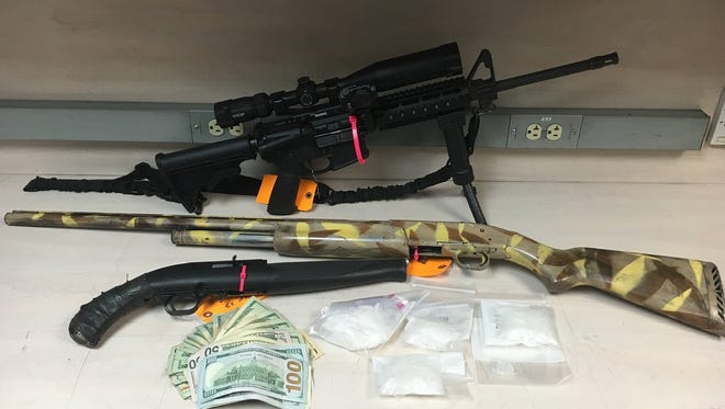 Investigators seized eight guns, six ounces of methamphetamine and cash during a Linn County drug bust.