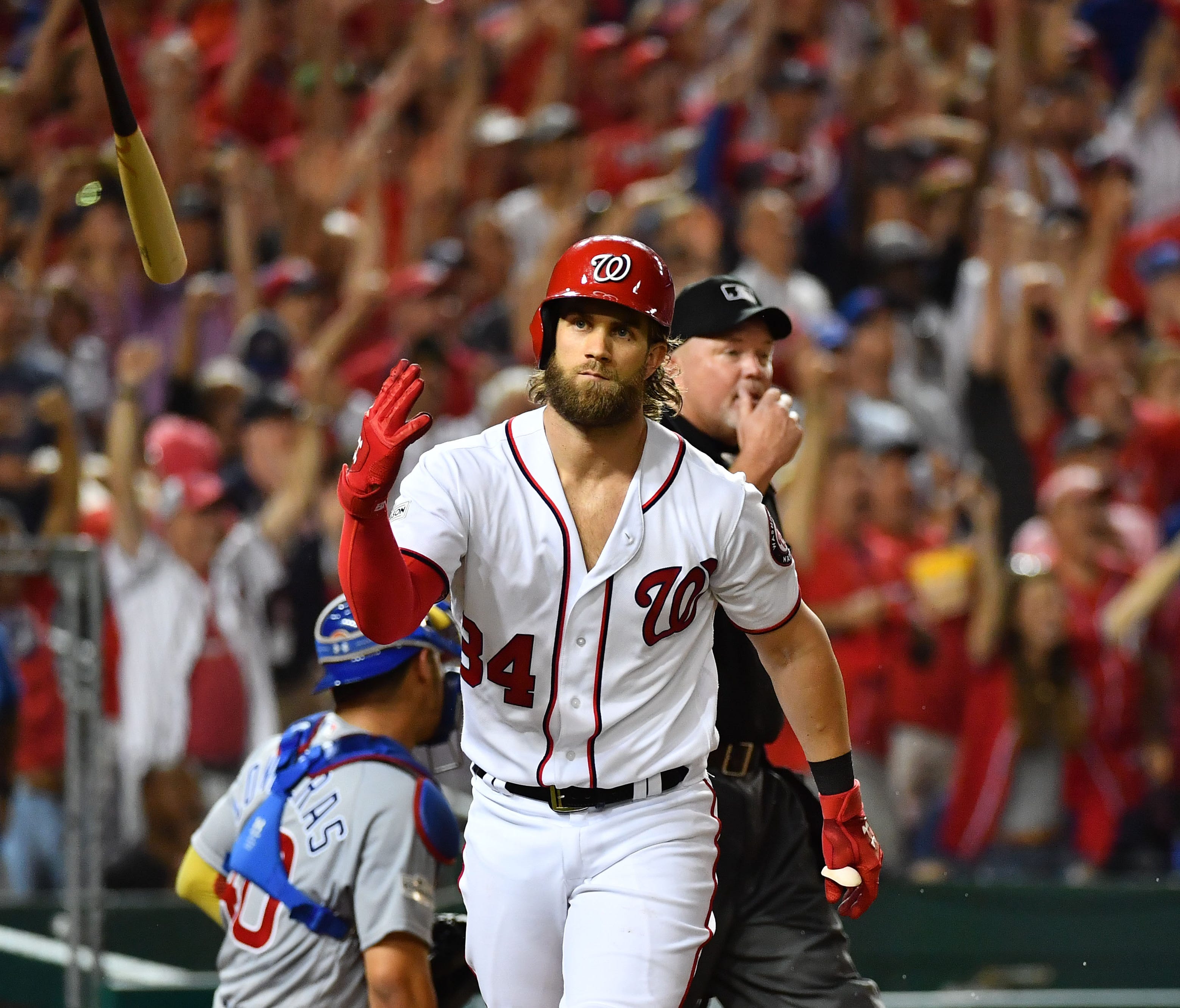 Bryce Harper flips the bat after a two-run home run in the eighth inning.