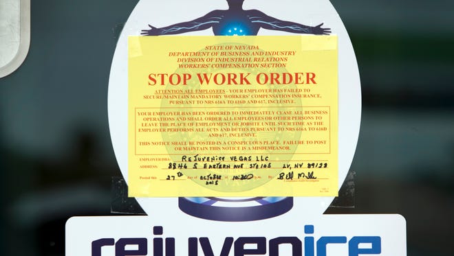 This Oct. 27 photo shows a Stop Work Order on the front door of the Rejuvenice spa in Las Vegas.