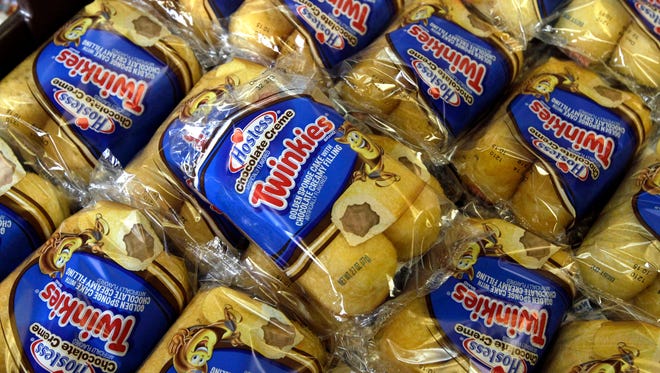 In this Nov. 16, 2013, file photo, Twinkies baked goods are displayed for sale at the Hostess Brands' bakery in Denver. Almost four years after seeking bankruptcy protection under a barrage of labor issues and rapidly changing appetites, the maker of Twinkies and Ding Dongs will take the stage once again as a publicly traded company Tuesday, July 5, 2016.
