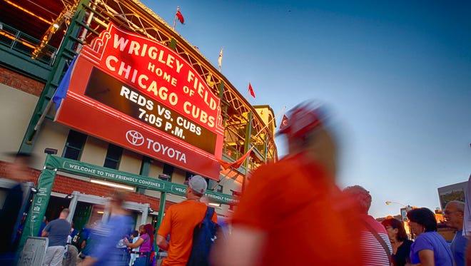A Cubs fan enters Wrigley Field before the September 20 game against the Reds.