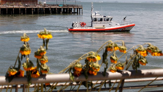 A U.S. Coast Guard boat patrols Monday, July 6, 2015, on Pier 14 in San Francisco.