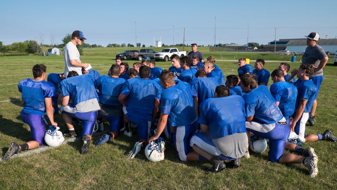 Cros-Lex High School head coach Garrett Grundman debriefs the team at the end of practice on Aug. 16. The Pioneers' first game will be against St. Clair on Aug. 24.