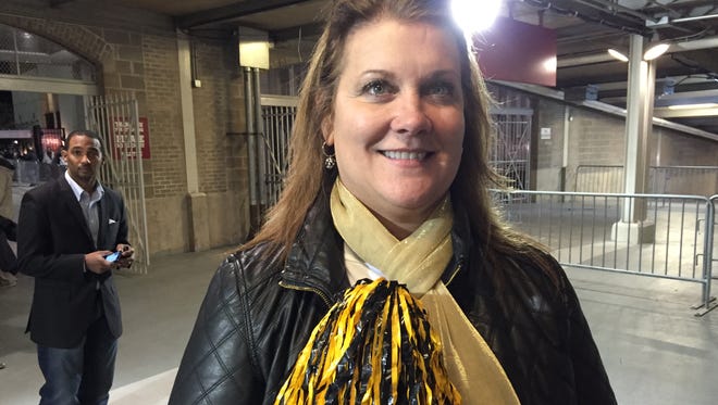 Troy women's basketball coach Chanda Rigby shows her support for Elba after Friday's 2A championship. Her son is the quarterback and her husband the coach of the Tigers.