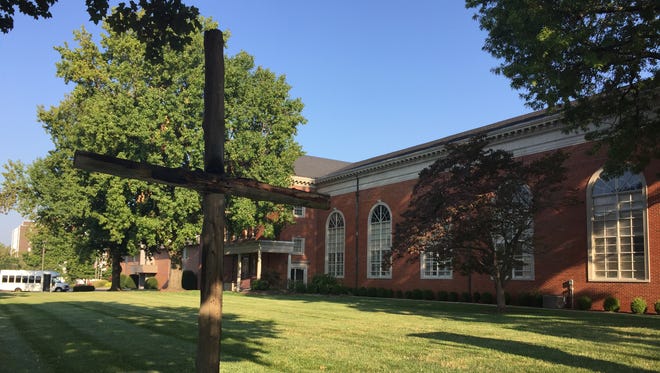 A wooden cross outside First Baptist Church was set on fire early Friday morning, a church administrator confirmed.