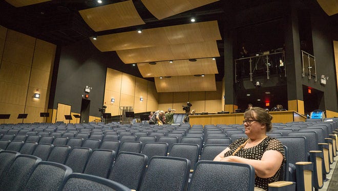 The new performing arts center is a big upgrade. Sandy Warren waits for the evening's performances to begin.