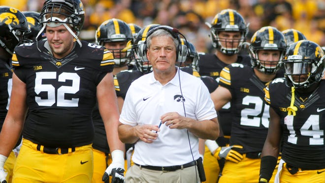 Head coach Kirk Ferentz of the Iowa Hawkeyes waits with his team during a play review in the second quarter against the Miami (OH) RedHawks at Kinnick Stadium in Iowa City, Iowa.