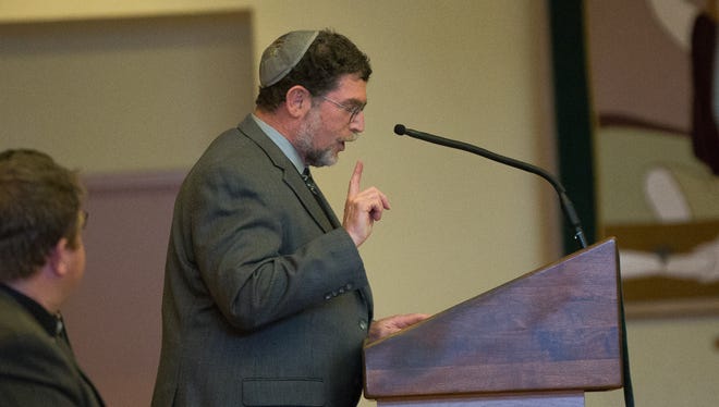 Rabbi Larry Karol of Temple Beth-El speaks at an interfaith gathering at St. Albert the Great Newman Center in February 2017.