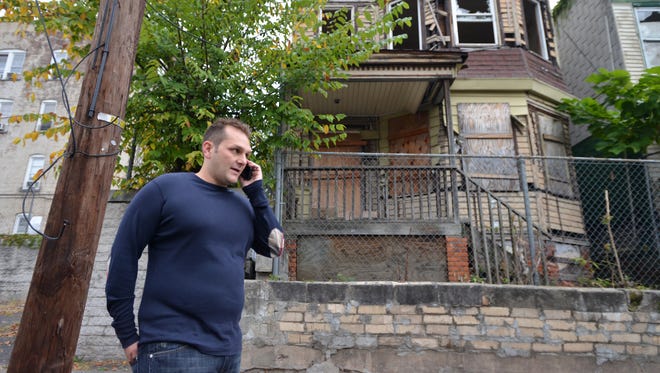 Developer Charles Florio checking out Paterson properties in 2014.