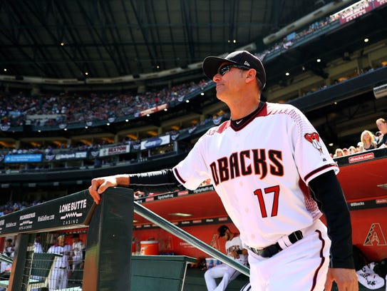 Diamondbacks manager Torey Lovullo stands in the dugout