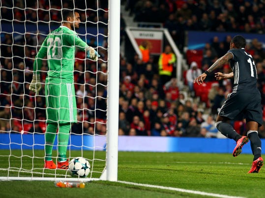 Manchester United's goalkeeper Sergio Romero, left, appeals to the officials for offside as CSKA's Vitinho celebrate after his team scored a goal during the Champions League group A soccer match between Manchester United and CSKA Moscow in Manchester, England, Tuesday, Dec. 5, 2017. (AP Photo/Dave Thompson)