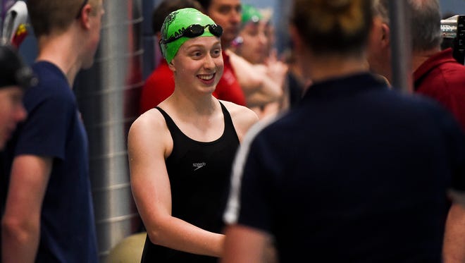 Fossil Ridge's Zoe Bartel receives an award for the 50 yard freestyle at the 5A State Swimming and Diving Championships, Saturday, Feb. 14, 2015, at EPIC in Fort Collins, CO.