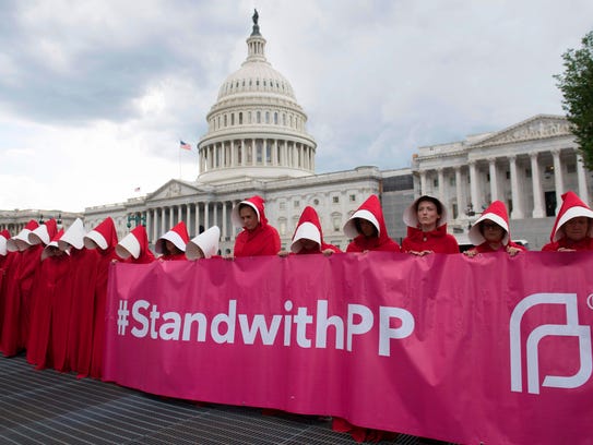 Supporters of Planned Parenthood dressed as characters
