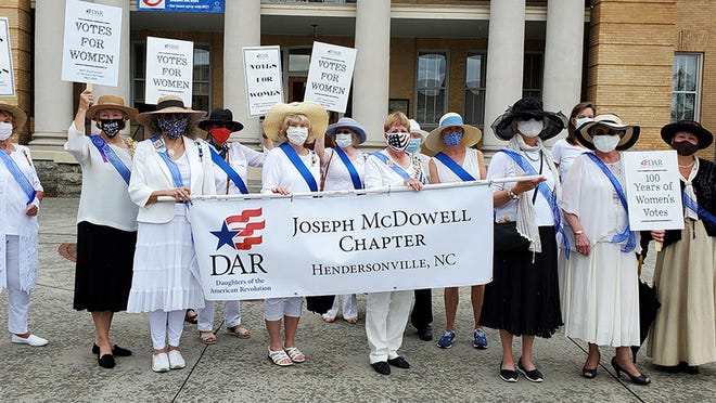 Joseph McDowell Chapter members participating in the 100th Anniversary of Women's Votes are, from left to right, Fran Hart, Cricket Crigler, Sharon Horan, Janice Saville Schwartz, Lynn McFarland, Sharon Coffey, Charlotte Walsh, Marilyn Haynes, Jan Dockendorf, Ann McFadden, Beth Lail, Linda Sizemore and Kellie Denny.