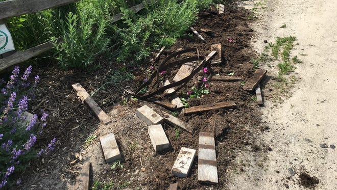 The remnants of a large flower barrel that was destroyed June 29 at Wills Park in Ellison Bay. The Ellison Bay Service Club is seeking donations to help replace the barrel and replant the flowers.