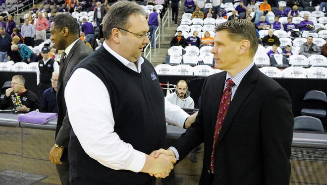 Evansville Aces head coach Marty Simmons, left, and Loyola Ramblers head coach Porter Moser shake hands before their game at the Ford Center in Evansville, Wednesday, Feb. 8, 2017. Evansville beat Loyola 60-58. 