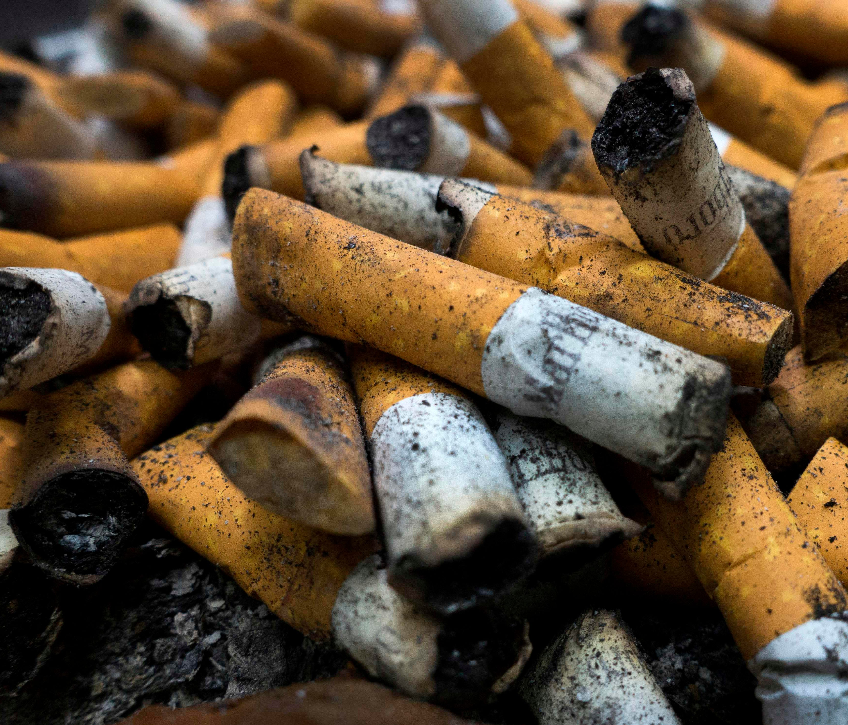 Smoked cigarettes are seen in an ashtray in Centreville, Virginia. Just 13.9 percent of the U.S. population smokes cigarettes, according to a U.S. government report.